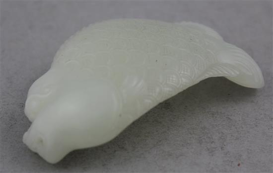 A Chinese white jade carving of dragon-fish, 8.5cm.